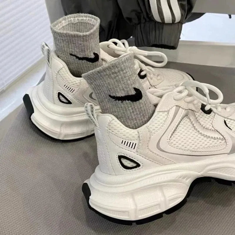 Beige mesh platform sports shoes with wedge heel and lace-up front on white background