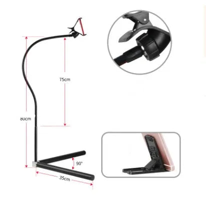 Black mobile phone bracket with universal folder attached to bed frame for hands-free viewing