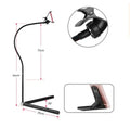 Black mobile phone bracket with universal folder attached to bed frame for hands-free viewing