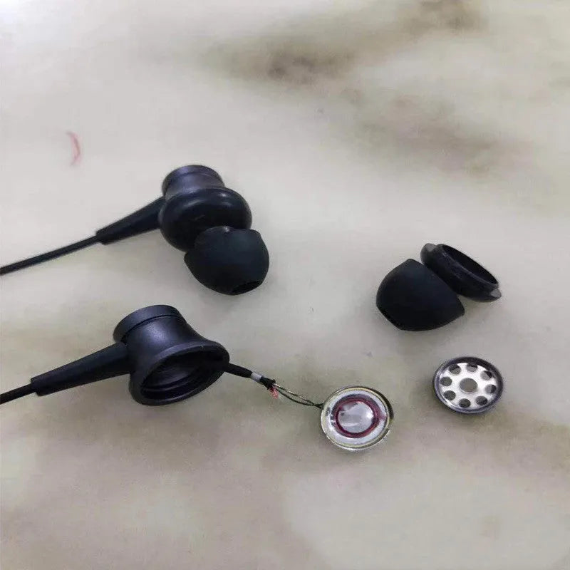 Black, blue, and red wired in-ear headphones showing their 3.5mm audio plug.
