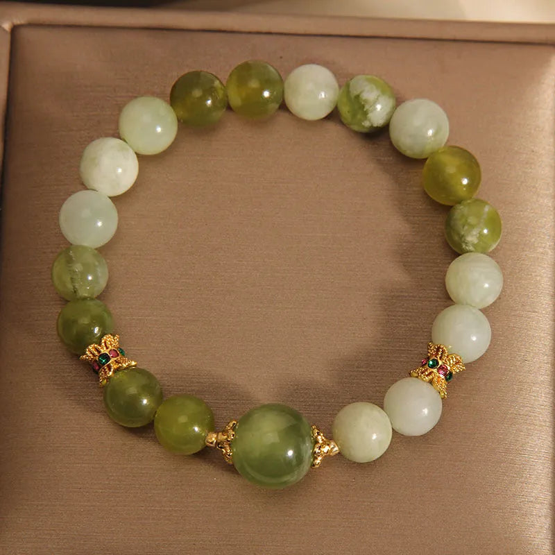 Women's bracelet made of green Xiuyan jade with an original sweet Mori style design.