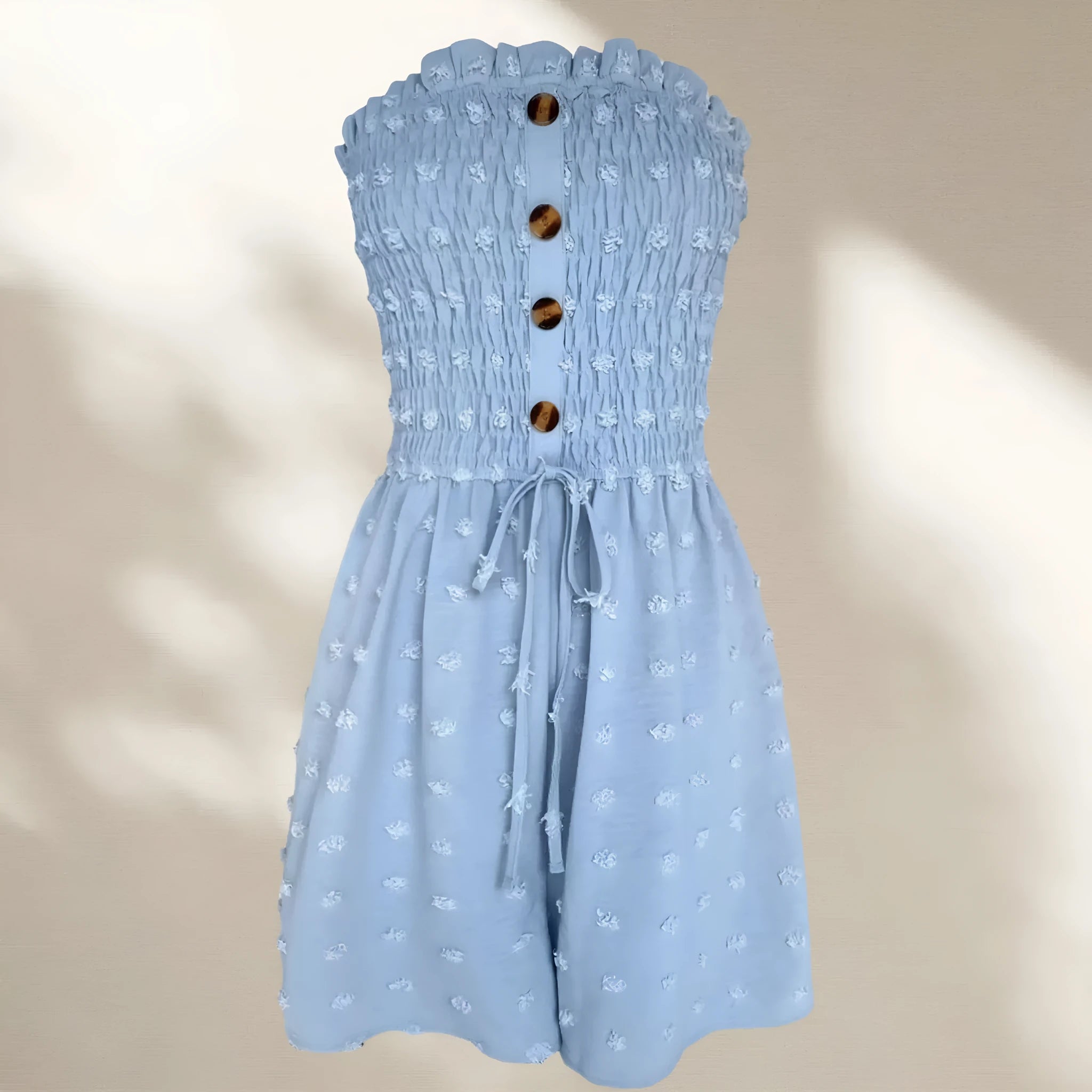 Women's sleeveless off-shoulder jumpsuit in polyester fabric showing button detailing and elastic waist