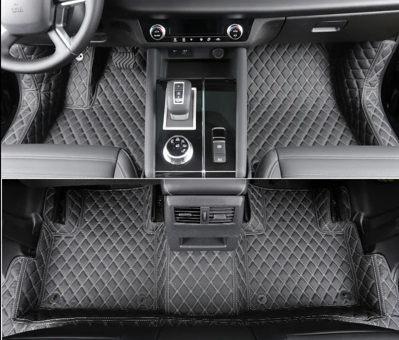 Custom black floor mats installed in a Mitsubishi Outlander footwell.