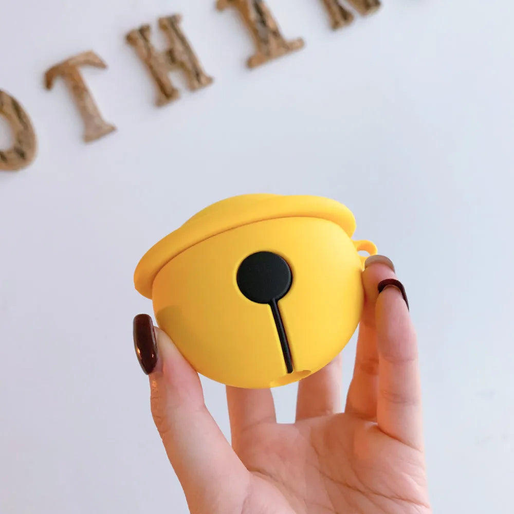 Yellow silicone protective case for AirPods with a small bell charm and a carry strap.