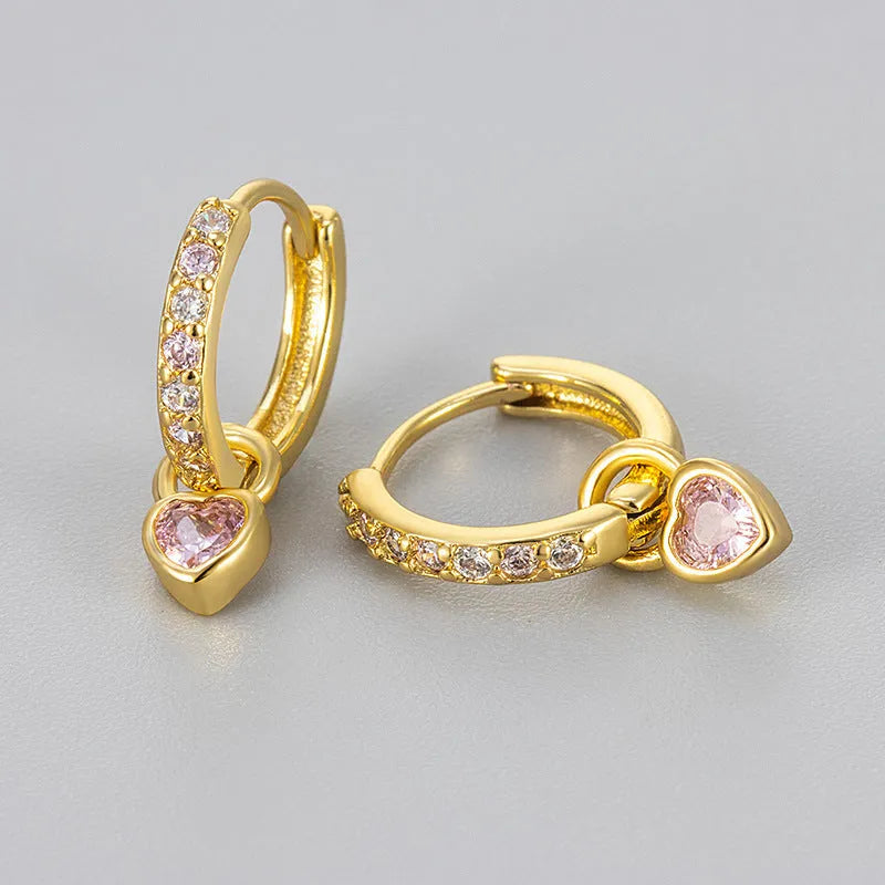 Heart-shaped ladies fashion earrings with coloured stone centrepiece and gold colour plating