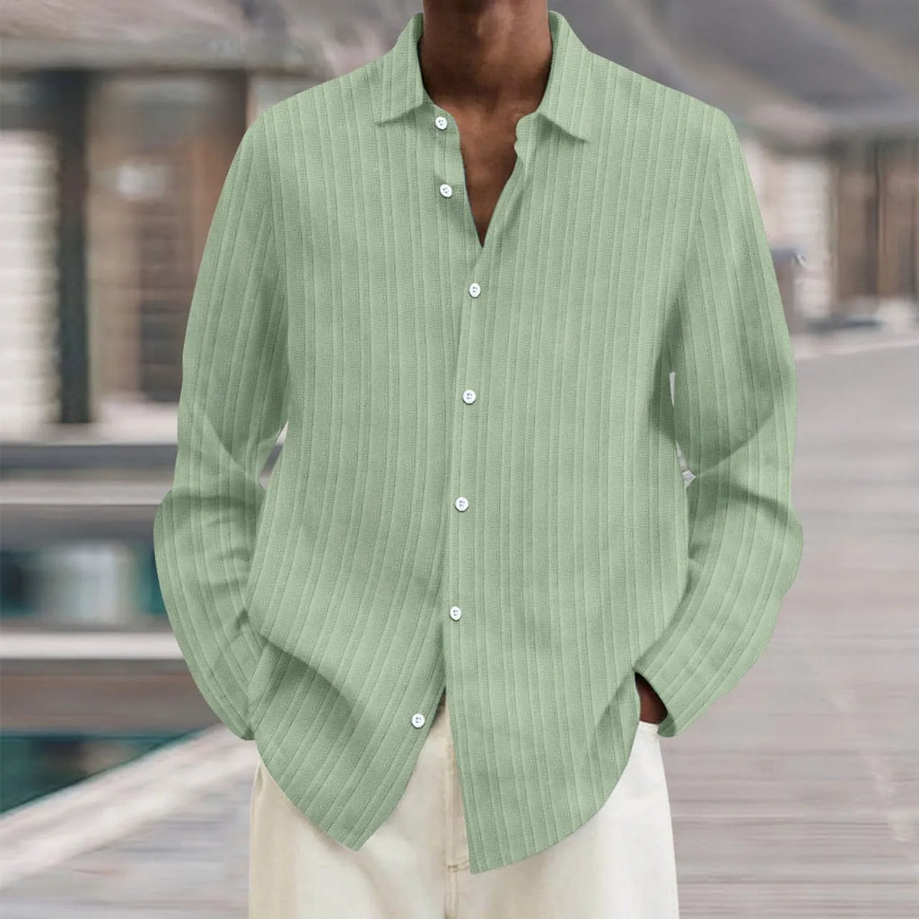 Man wearing a striped British style loose fit long sleeve cardigan shirt.
