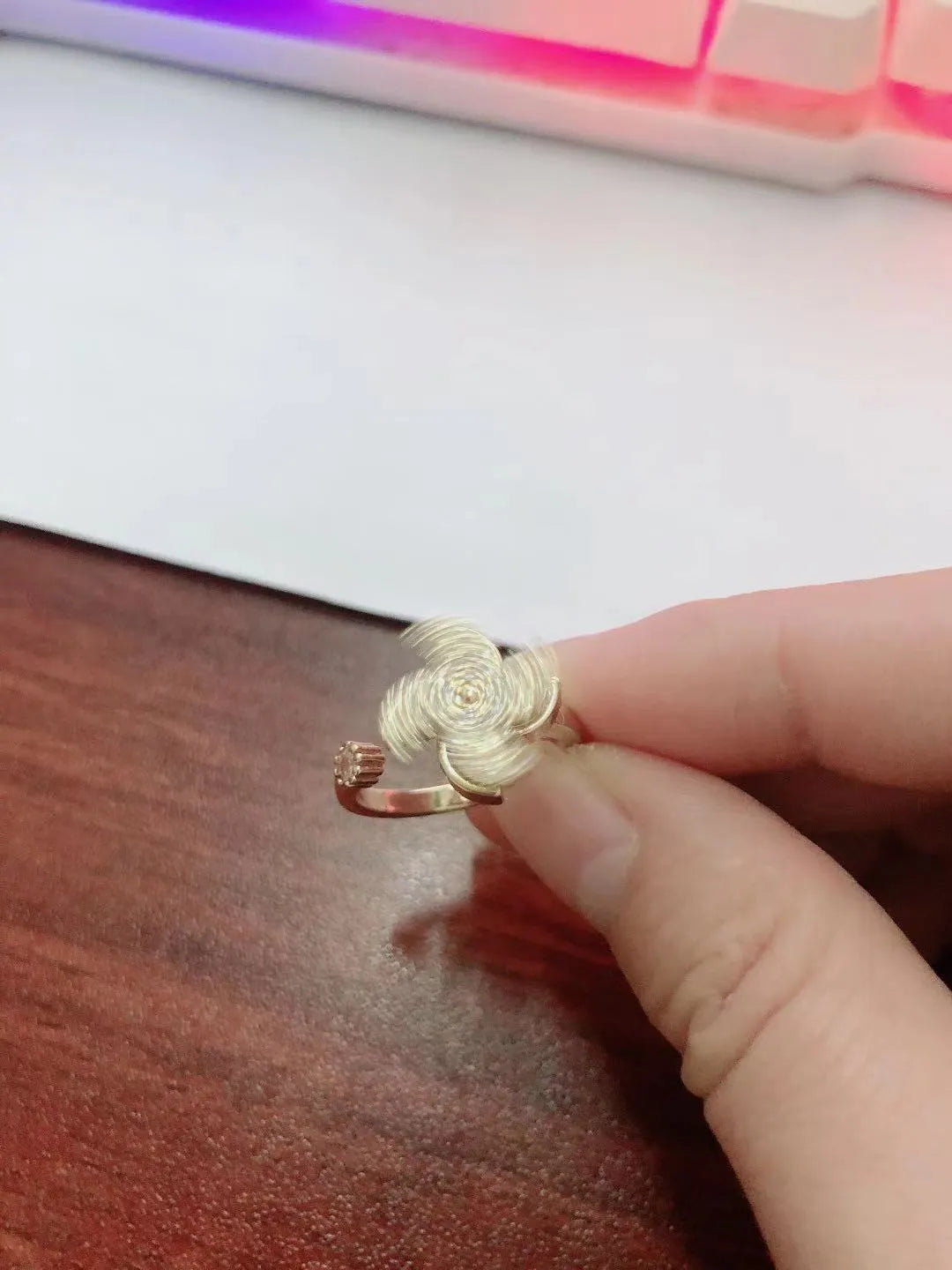 Copper spinning windmill ring with rotating geometric design in gold or silver electroplated finish