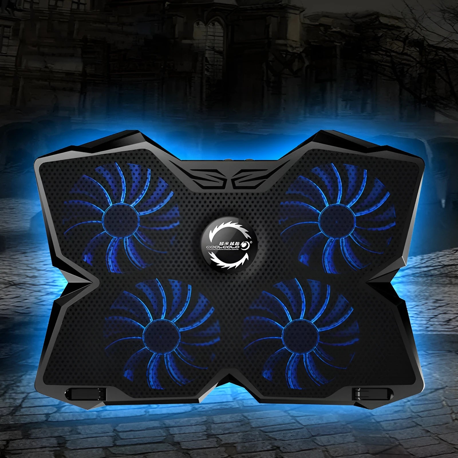Blue laptop cooling pad with four illuminated fans, two USB ports, and speed control switches on a desk.