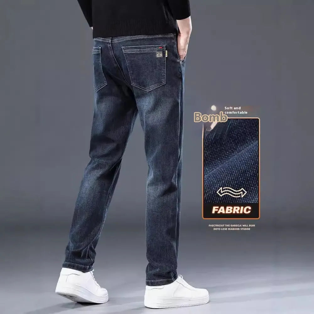 Blue grey slim straight leg casual trousers on a hanger, showing the mid-rise waist and zipper fly.