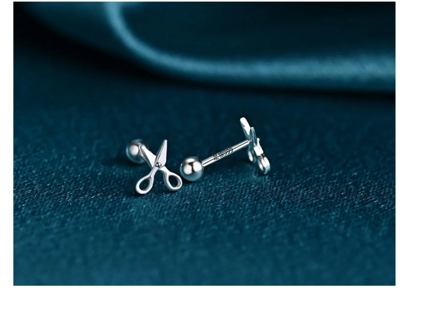 Sterling silver ear nail earrings with screw closure and miniature scissors charm.
