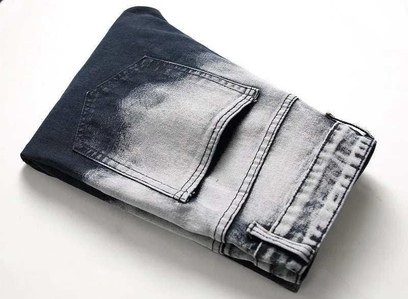 Men's blue and white faded cotton denim jeans with distressed worn finish, straight leg style