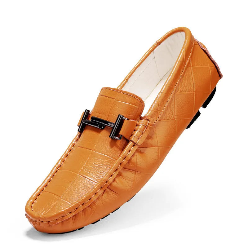 Men's black leather casual pea shoes with a silver belt buckle and flat rubber sole.