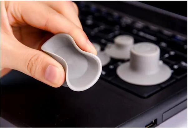 Grey laptop cooling pad set with four durable plastic pads for laptop temperature reduction