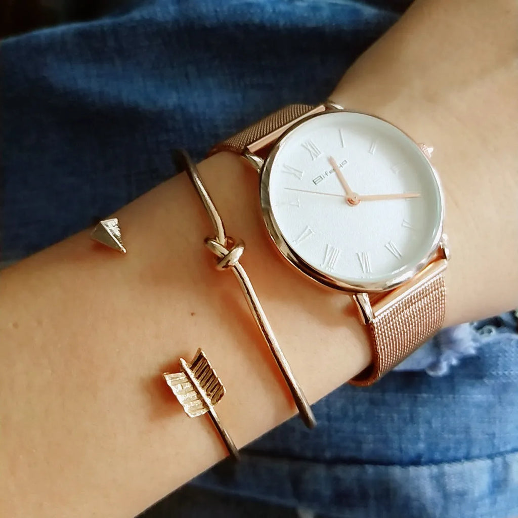 Gold vintage cuff bracelet for women with an arrow knot design detail.