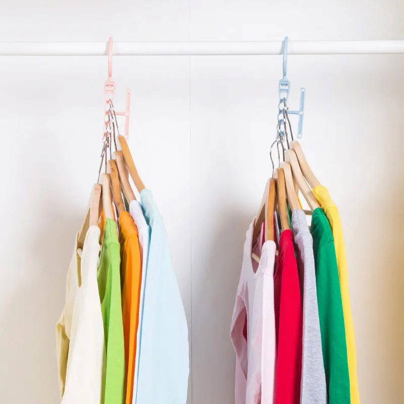 Blue revolving wardrobe hanger with five rotating arms and a handle for clothes organisation.