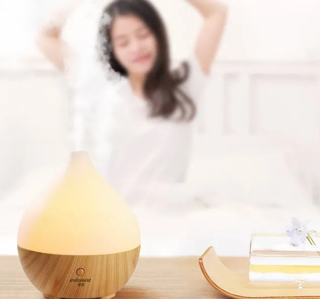Asakusa wood grain finish vase-shaped USB aroma diffuser on a table.