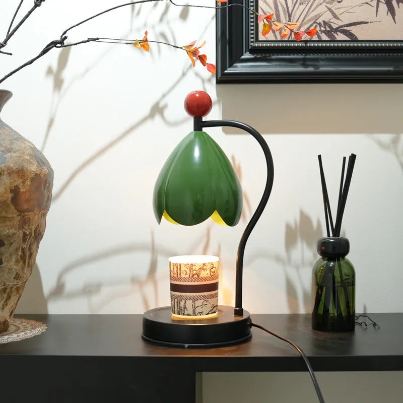 Linglan ancient style cream white melting wax lamp with metal holder on a desk.