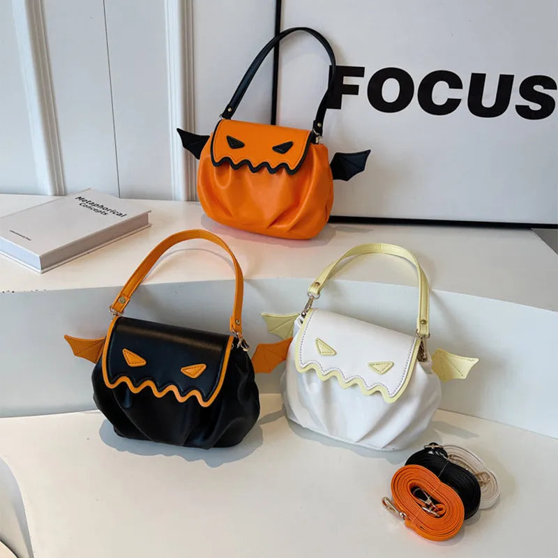 Orange PU crossbody bag with pumpkin cartoon shape and small wings, placed on a neutral background