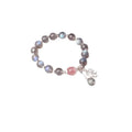 Silver grey women's bracelet with honeysuckle pattern, moonlight crystals, and a small zodiac charm.