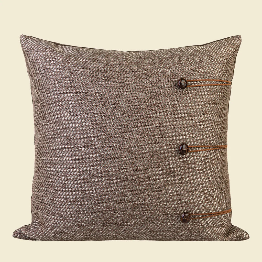 Square Chinese ancient style cushion in brown Maillard colour on a sofa.