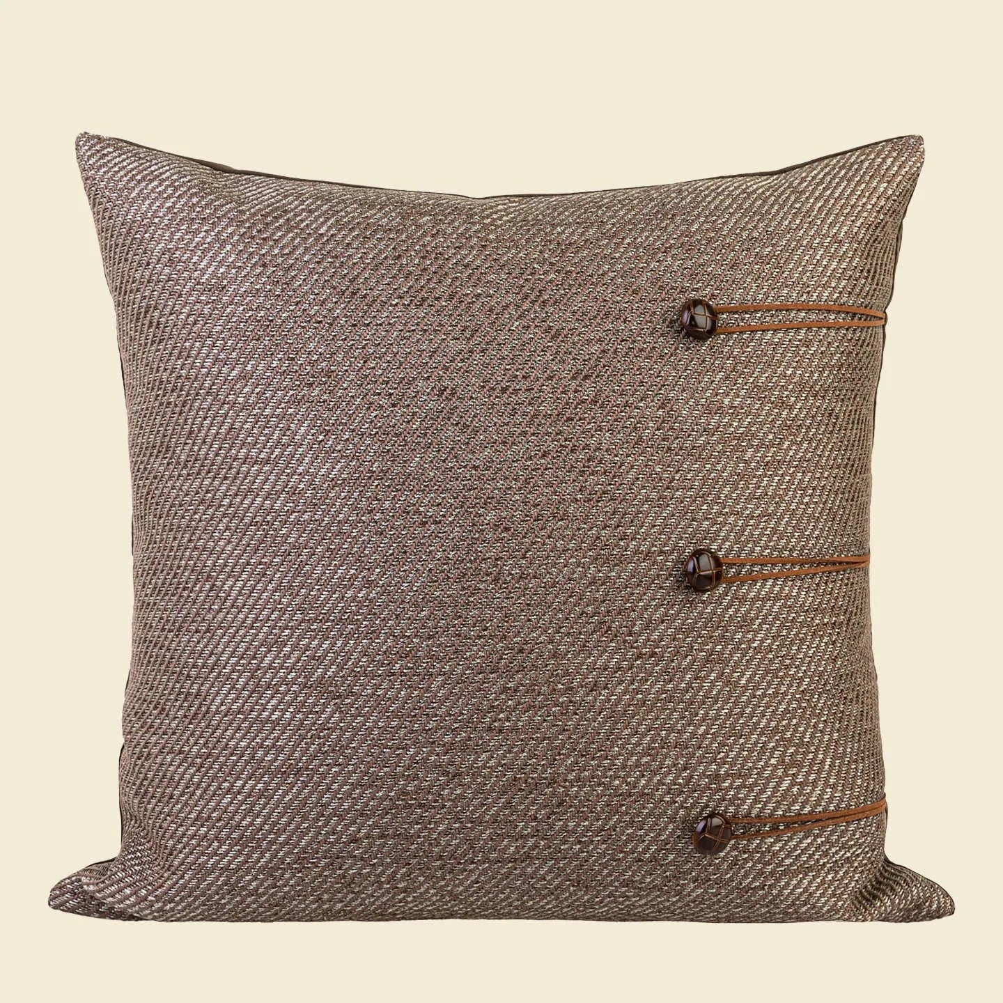 Square Chinese ancient style cushion in brown Maillard colour on a sofa.
