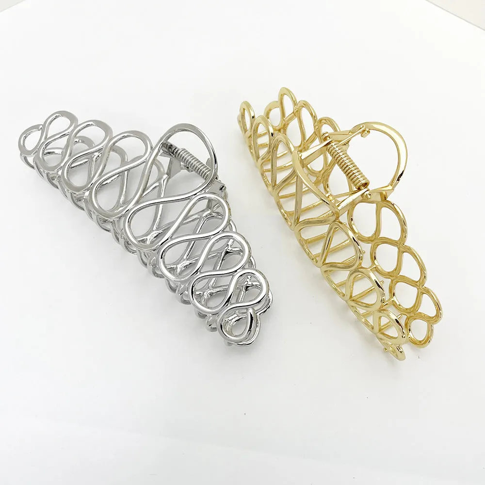 Large minimalist updo hair clip with tassel detail in gold or silver electroplated finish