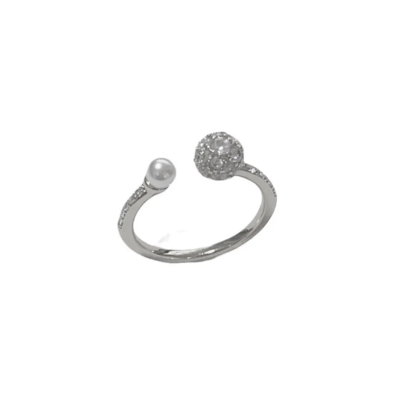 Open-end women's ring with round zircon stone on geometric band in gold or silver finish.