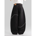 Black straight-leg denim trousers with micro-elastic fabric and mid-waist zip fly
