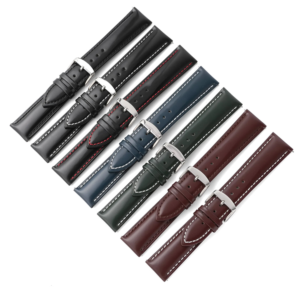 Quick release leather watch strap in dark brown with buckle and quick-release spring bars visible
