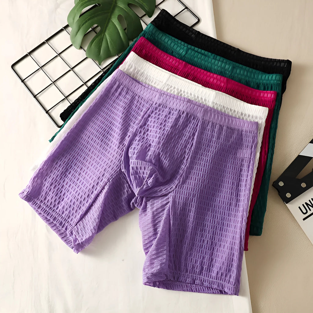 Men's solid colour lace shaping boxer underwear on a neutral background.