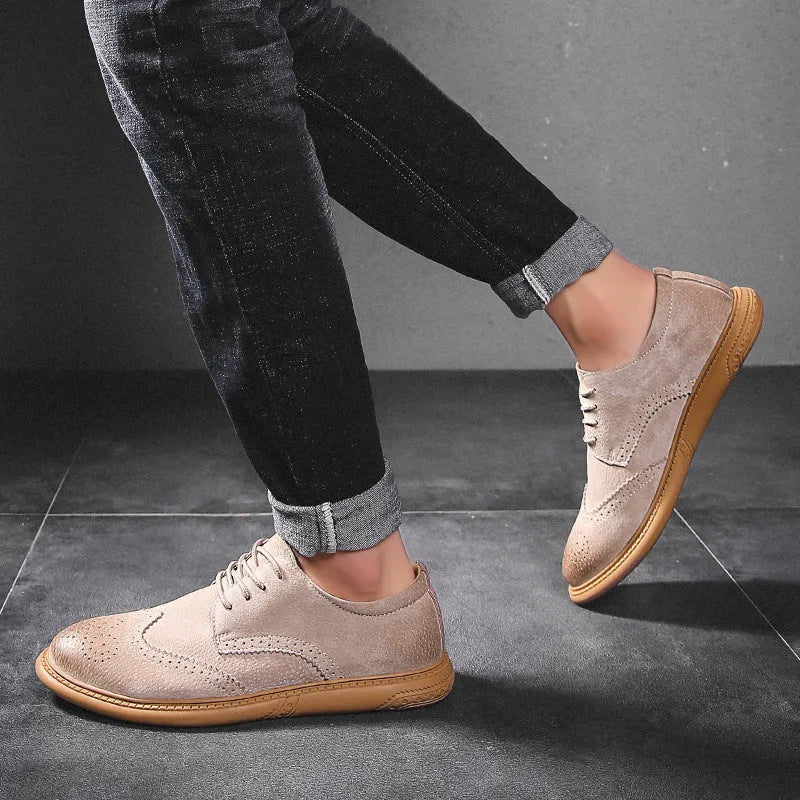 Men's black low-top leather lace-up business shoes with stitching detail on a white background.