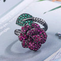 Gold-plated women's ring with a geometric black gold flower design and simulated red corundum detail.