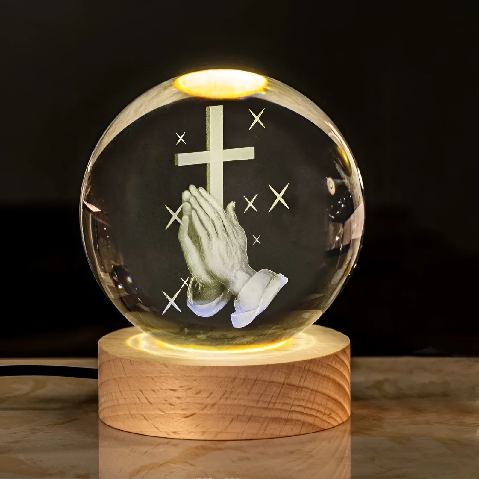 Clear white 6cm crystal ball desk ornament on wooden LED base showing Christian symbol insert
