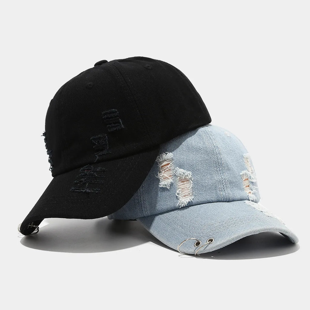 Men's adjustable cotton denim baseball cap in black on a plain background.