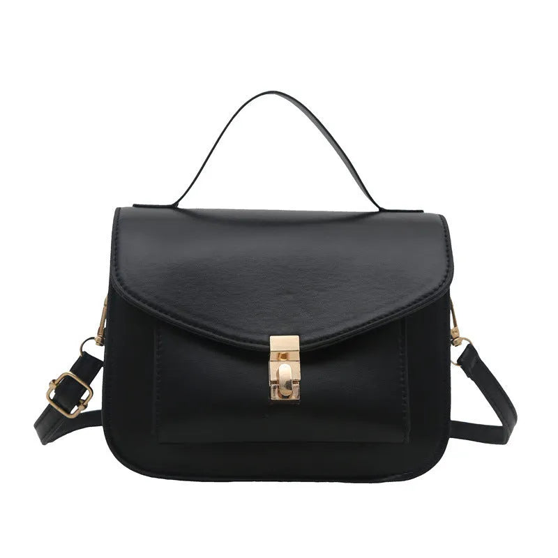 Retro style square messenger bag in PU with a crossbody strap and internal document pocket.