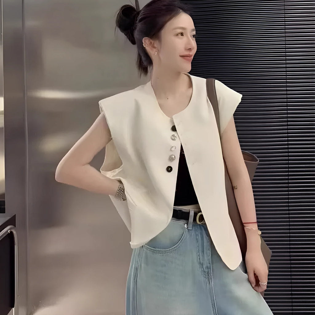 Women's loose-fitting solid colour polyester vest with a pocket, shown in milky white.