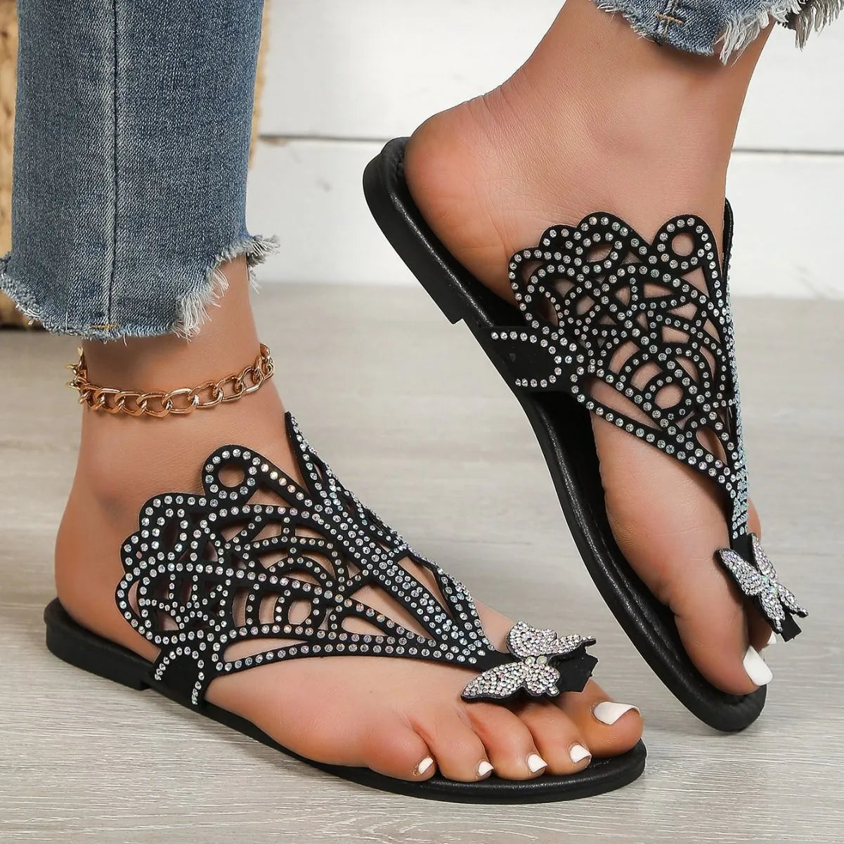 Women's black slip-on sandals with rhinestone decoration and flip-toe design