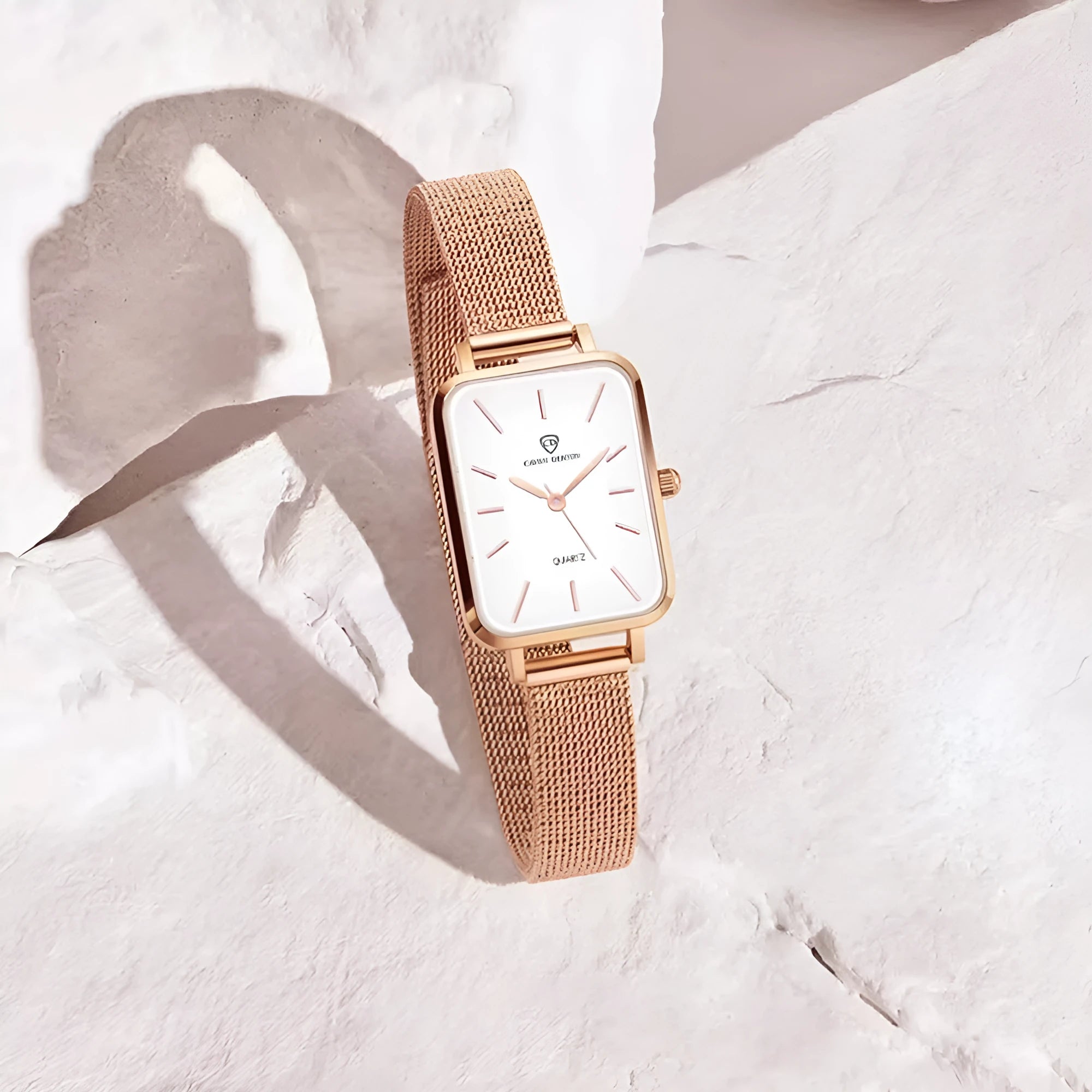Women's rose gold or silver waterproof quartz watch with alloy case and woven steel strap.
