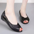 Women's black peep toe casual sandals with an ankle buckle and a rubber sole, shown in a Pop style.