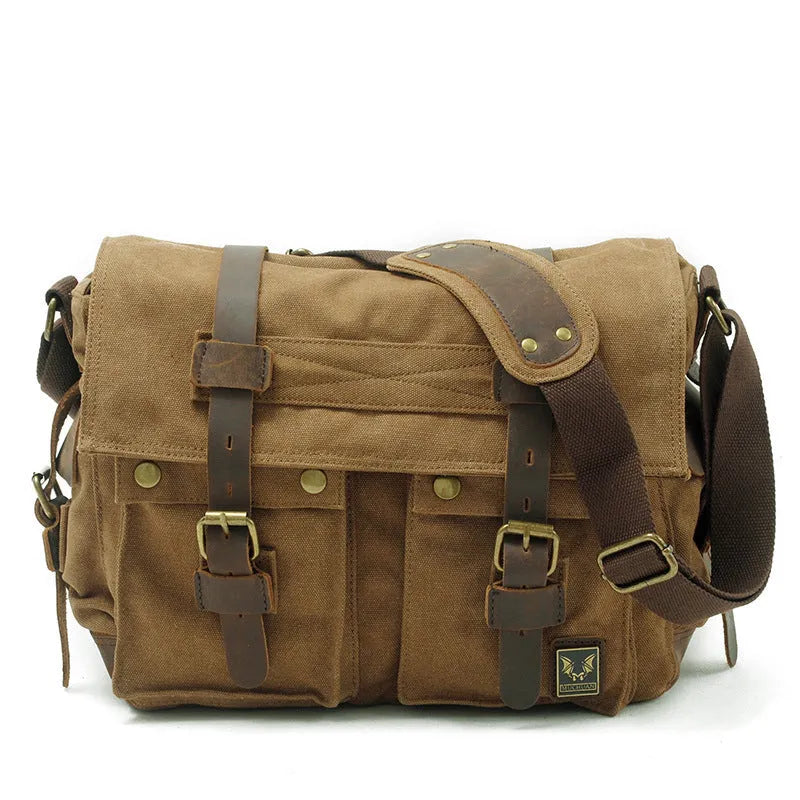 Men's brown canvas crossbody shoulder bag with cowhide trim and flap closure.