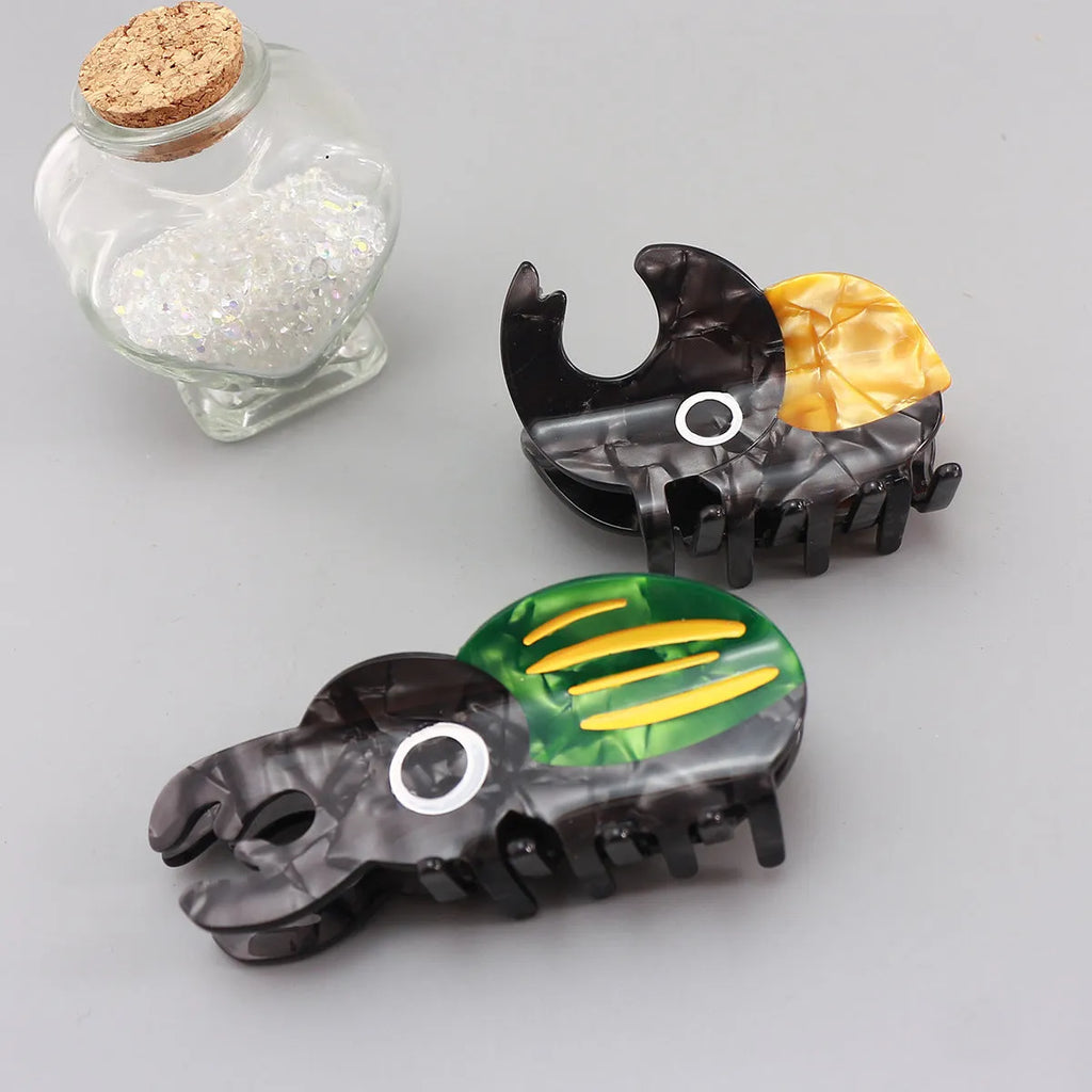 Handmade cartoon beetle and caterpillar design grip made from green cellulose acetate for stationery