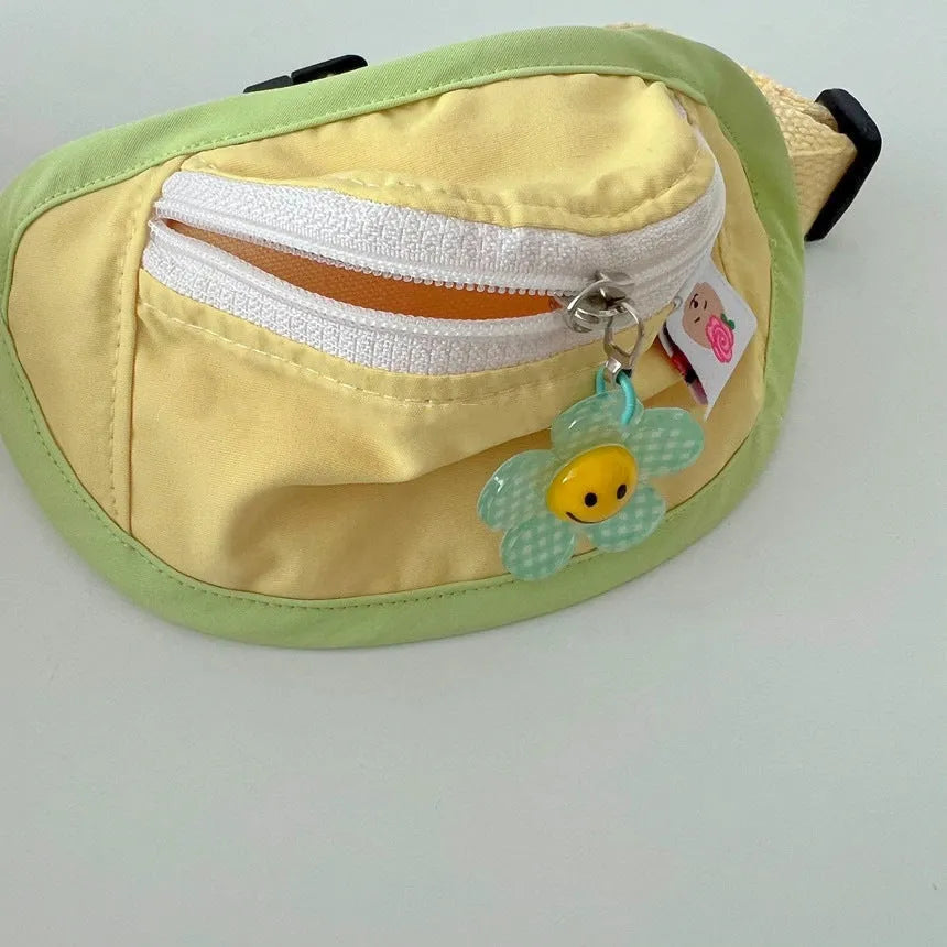 Powder blue and yellow adjustable pet carrier backpack worn on a person's back.