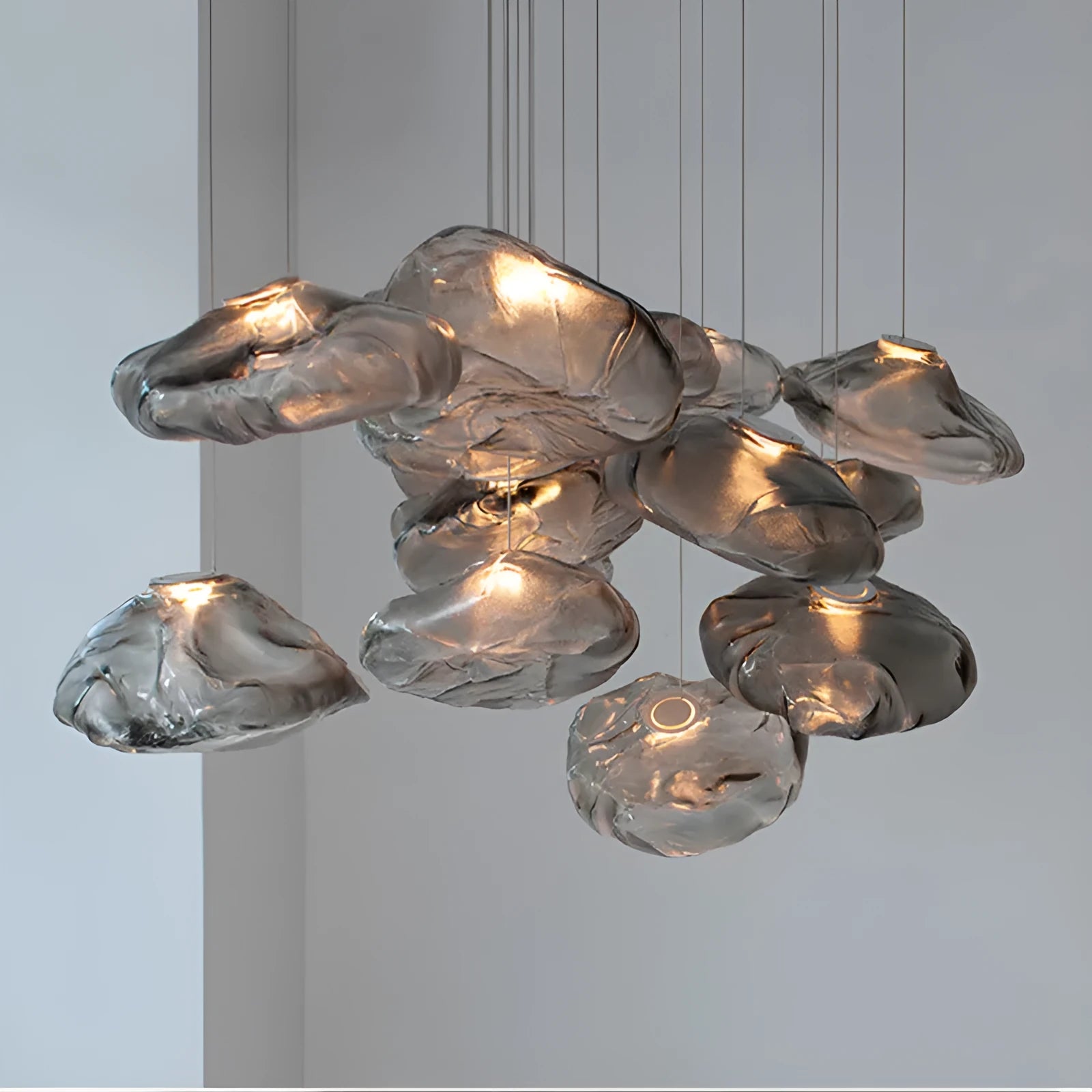 Modern decorative chandelier with glass shade in amber, clear or smoke grey colour options