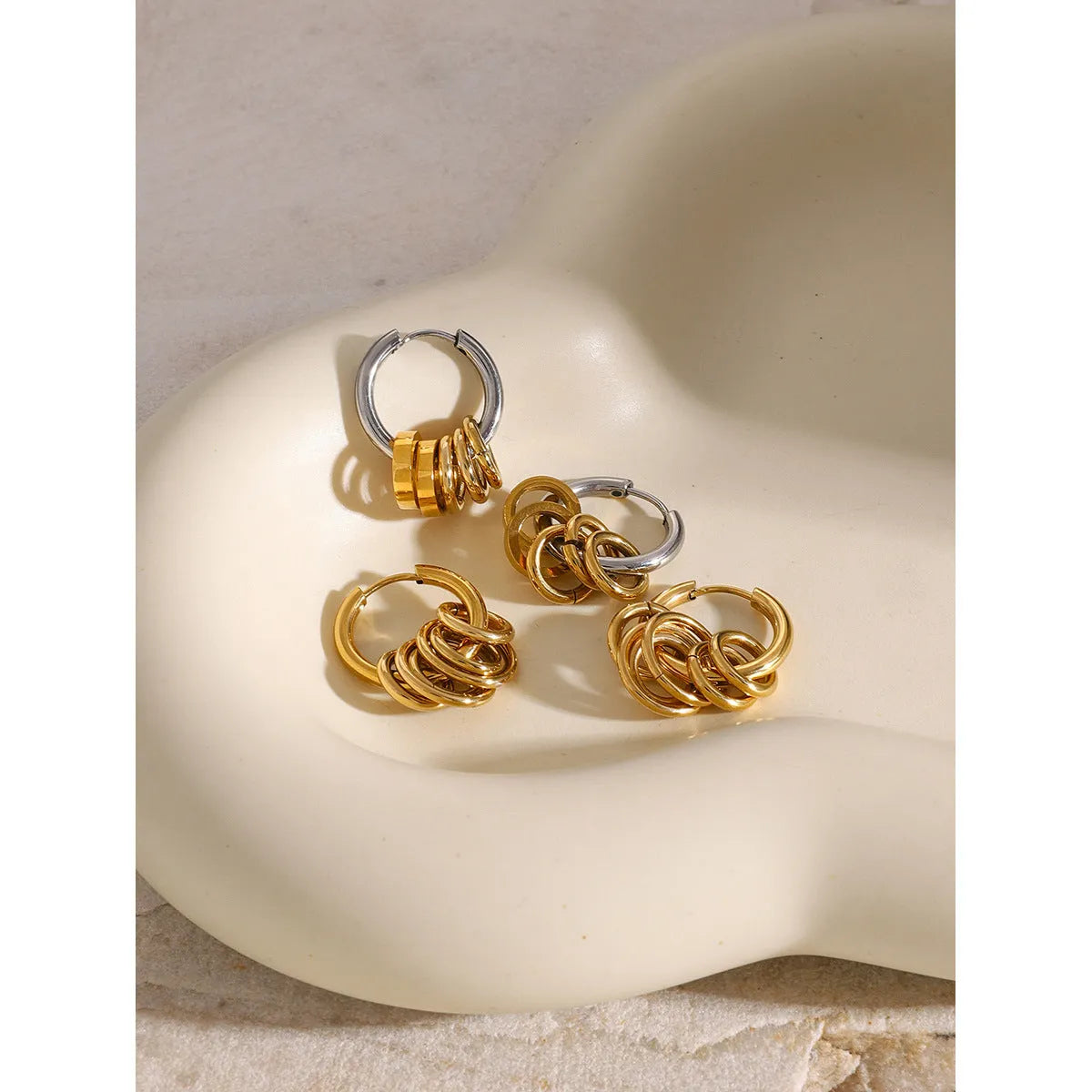 Ins style stainless steel colour matching earrings with electroplated finish showing unisex design