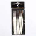 12 pearl white handled artist brushes with nylon wool bristles, stored upright in a solid wood pen holder.