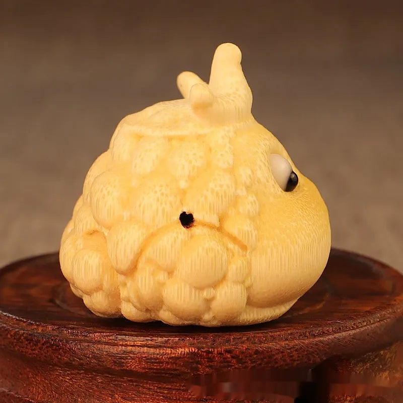 Solid bamboo carving of a Crown Princess Toad ornament with live eyes, 5.0cm.