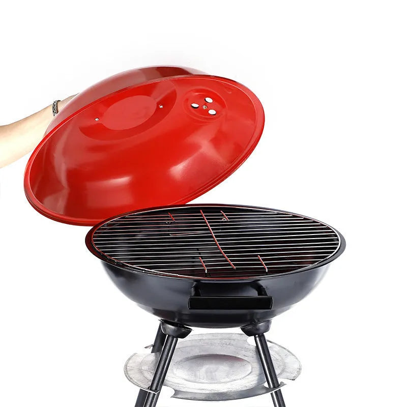 Portable iron barbecue grill with a 14-inch circular cooking grate.