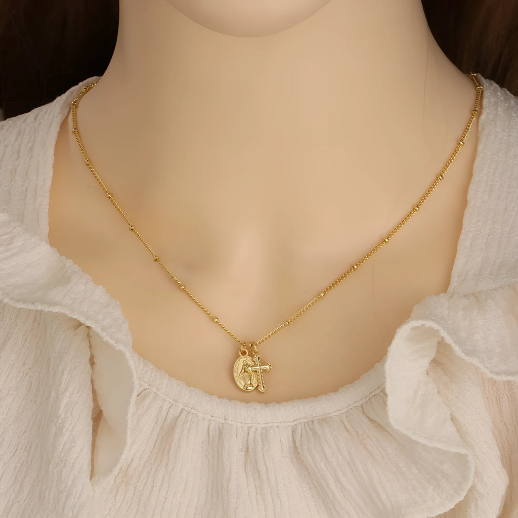 Gold Virgin Mary cross necklace with geometric pendant design for women