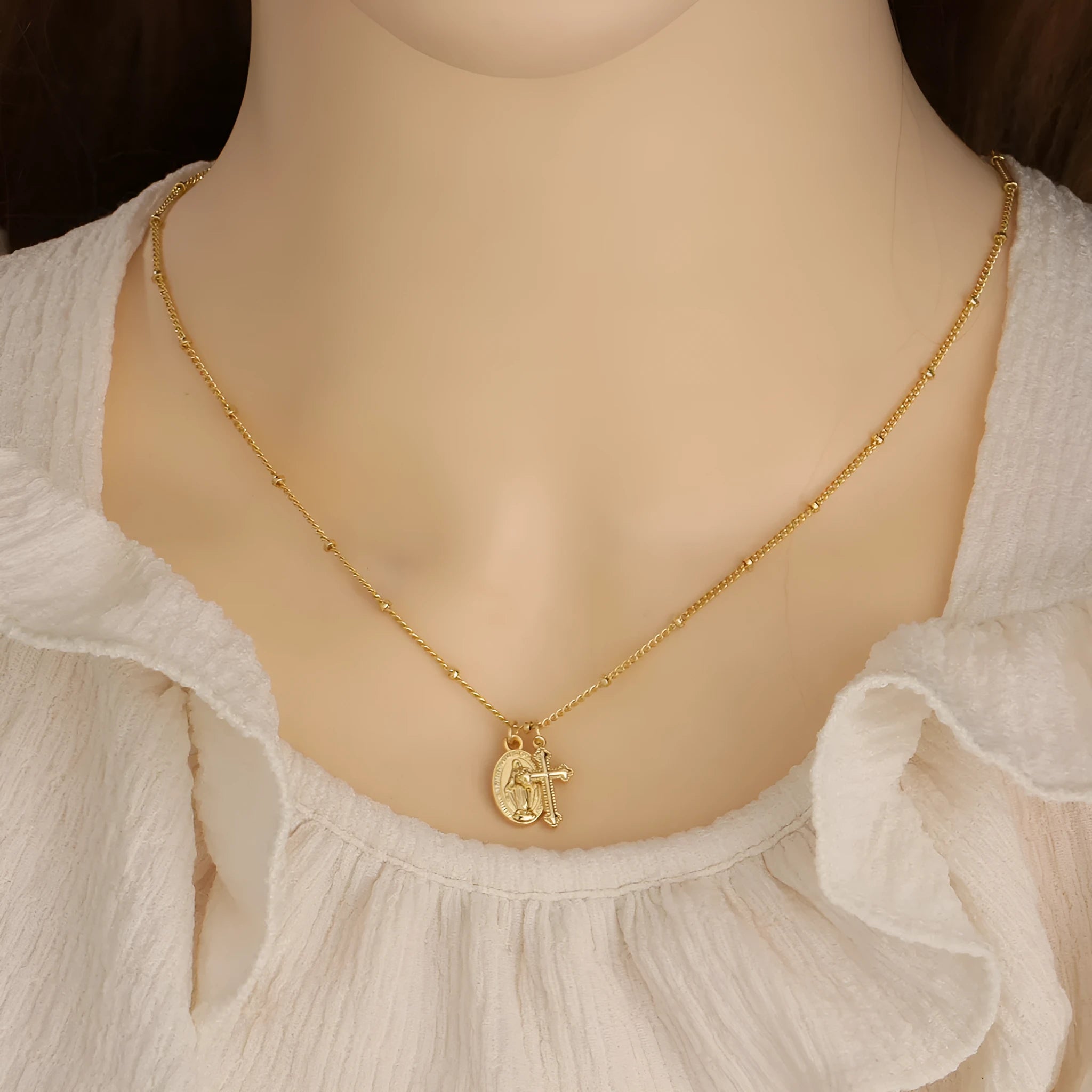 Gold Virgin Mary cross necklace with geometric pendant design for women