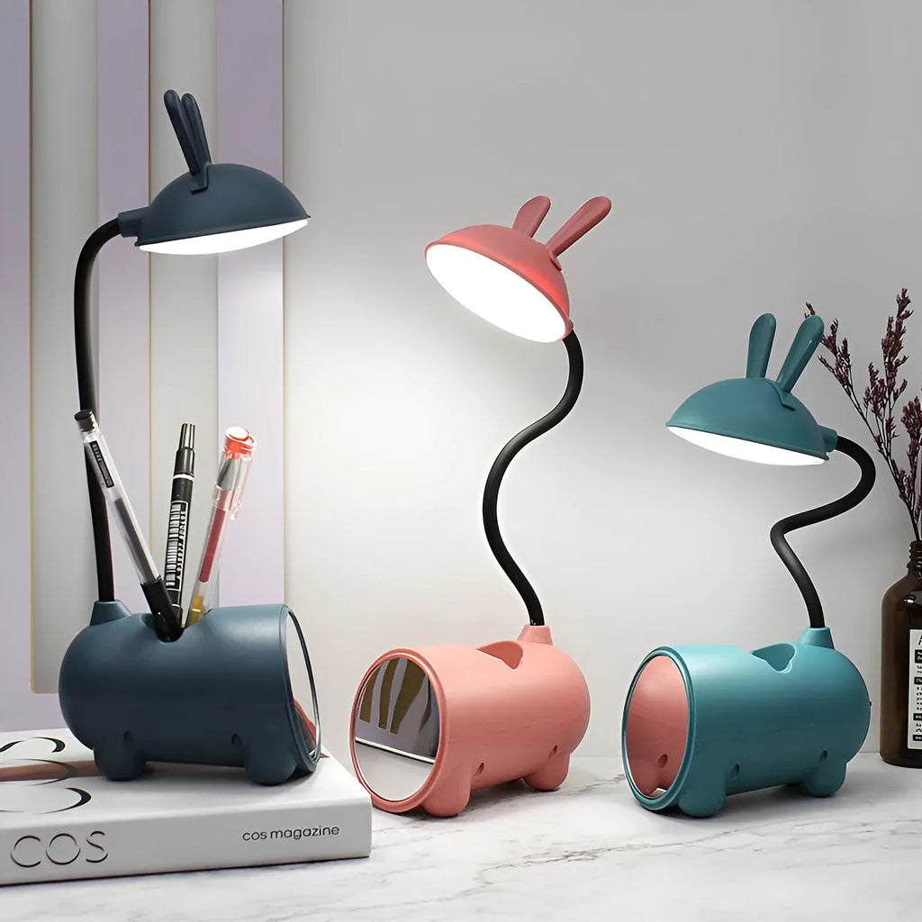 Green cartoon desk lamp with USB power and built-in pen holder container on desk